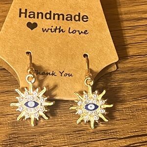 Gold Sun Earrings with Blue Eye Design